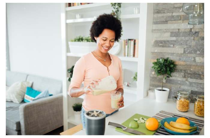 woman-with-protein-shake-in-kitchen